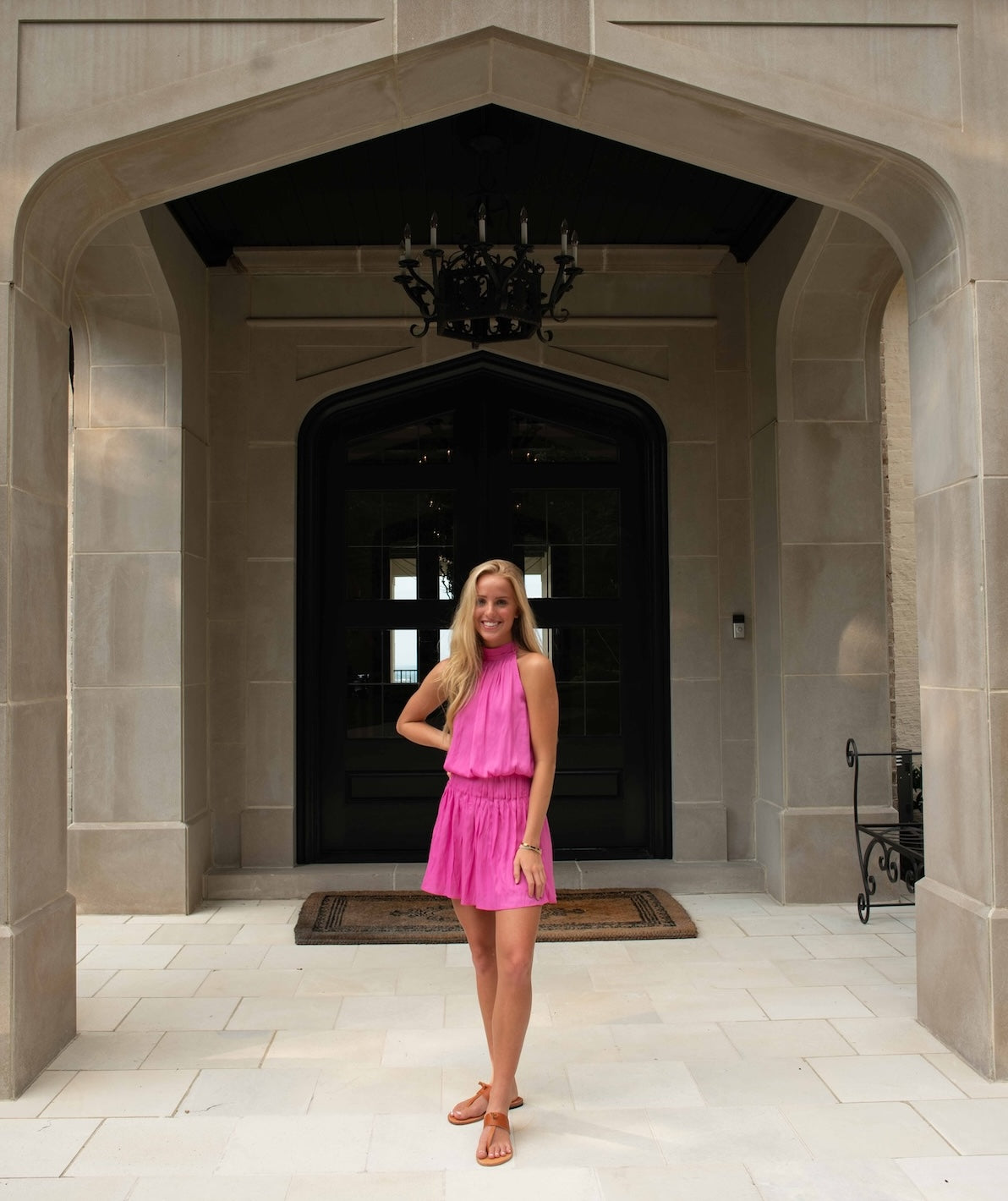 Female standing at entryway in sandals